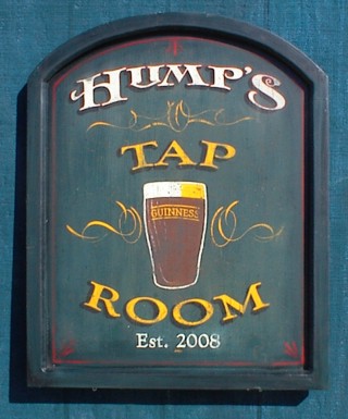 This wooden pub sign was custom made for someone's personal bar.